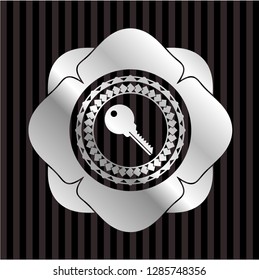 key icon inside silvery emblem or badge