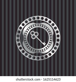 key icon inside silvery emblem or badge