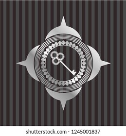 key icon inside silvery shiny badge