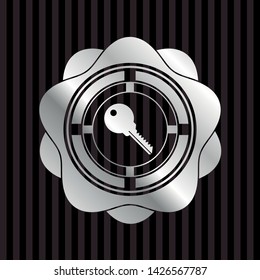 key icon inside silvery shiny badge