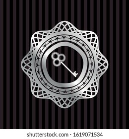 key icon inside silvery shiny badge