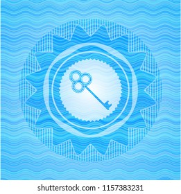 key icon inside sky blue water wave style badge.