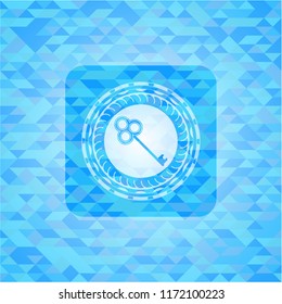 key icon inside sky blue mosaic emblem
