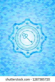 key icon inside sky blue mosaic emblem