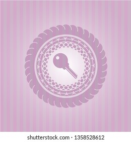 key icon inside vintage pink emblem