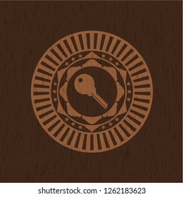 key icon inside vintage wooden emblem