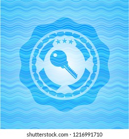 key icon inside water wave representation emblem.