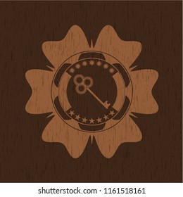 key icon inside wood badge or emblem
