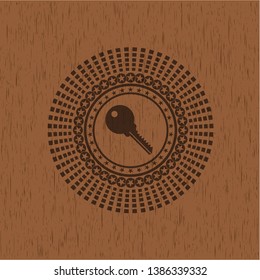 key icon inside wood emblem