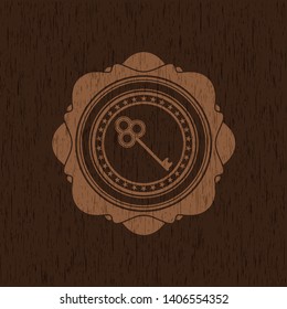 key icon inside wood emblem