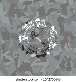 key icon on grey camo pattern