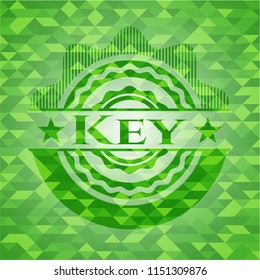 Key realistic green emblem. Mosaic background