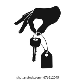 Key with a key ring in his hand. E-commerce single icon in black style vector symbol stock illustration web.