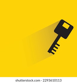 key with shadow on yellow background
