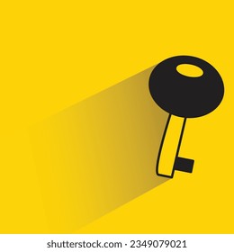 key with shadow on yellow background