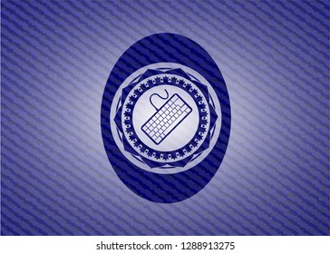 keyboard icon inside badge with denim background