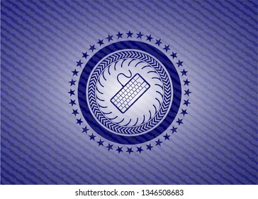 keyboard icon inside badge with jean texture