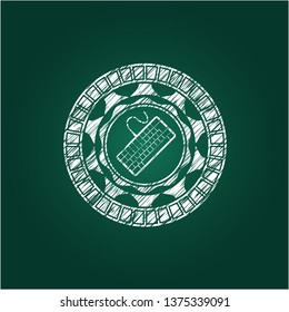 keyboard icon inside chalk emblem written on a blackboard
