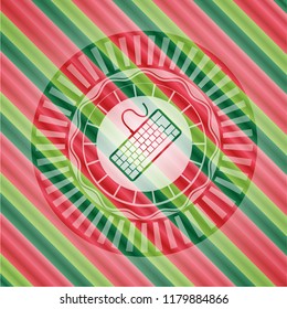 keyboard icon inside christmas colors badge.