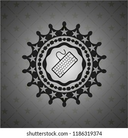 keyboard icon inside dark emblem