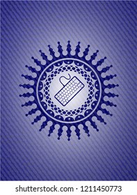 keyboard icon inside emblem with denim texture