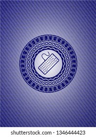 keyboard icon inside emblem with denim texture
