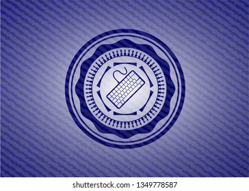 keyboard icon inside emblem with denim texture
