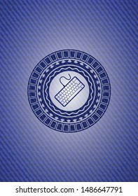 keyboard icon inside emblem with jean texture