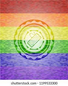 keyboard icon inside emblem on mosaic background with the colors of the LGBT flag
