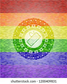 keyboard icon inside emblem on mosaic background with the colors of the LGBT flag