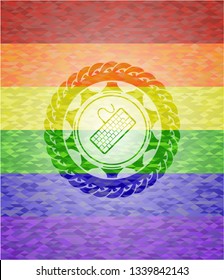 keyboard icon inside emblem on mosaic background with the colors of the LGBT flag