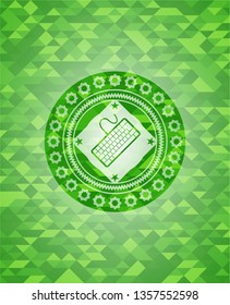keyboard icon inside green emblem with mosaic background
