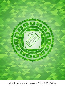 keyboard icon inside green emblem with mosaic ecological style background