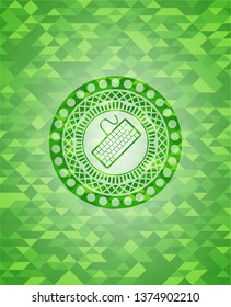 keyboard icon inside green mosaic emblem