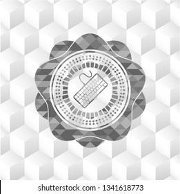 keyboard icon inside grey badge with geometric cube white background
