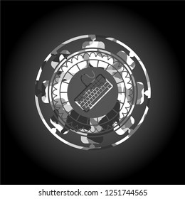keyboard icon inside grey camouflage emblem