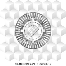 keyboard icon inside grey emblem with geometric cube white background