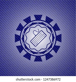 keyboard icon inside jean or denim emblem or badge background