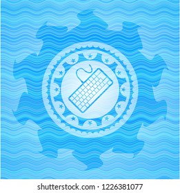 keyboard icon inside light blue water wave badge.