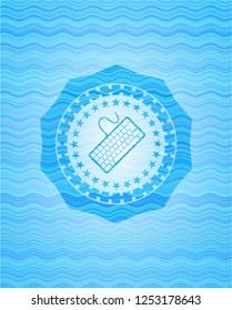 keyboard icon inside light blue water wave emblem.