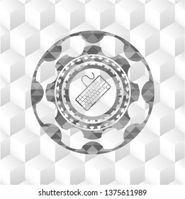 keyboard icon inside realistic grey emblem with geometric cube white background