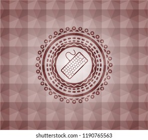 keyboard icon inside red seamless emblem with geometric background.