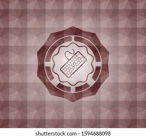 keyboard icon inside red seamless emblem with geometric pattern.