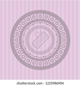 keyboard icon inside retro pink emblem
