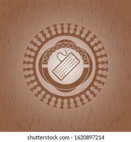 keyboard icon inside retro style wooden emblem