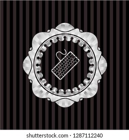 keyboard icon inside silver badge or emblem
