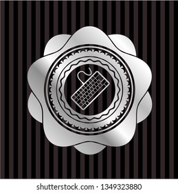 keyboard icon inside silver badge or emblem