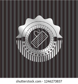 keyboard icon inside silver emblem