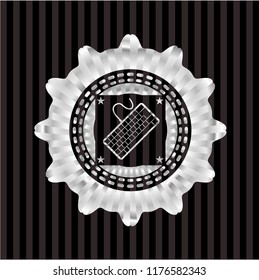 keyboard icon inside silvery badge or emblem