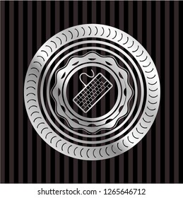 keyboard icon inside silvery emblem or badge